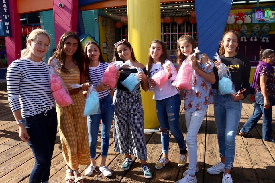 Group enjoying cotton candy on the Santa Monica Pier