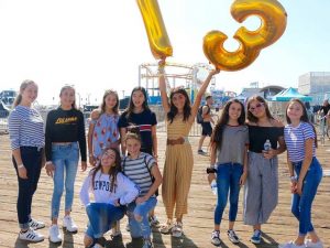 Group of girls celebrating a birthday on the Santa Monica Pier