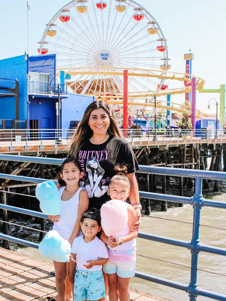 Family in front of Santa Monica Pier Ferris Wheel