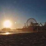 The sun sets behind the Santa Mmonica Pier - a great place for kids