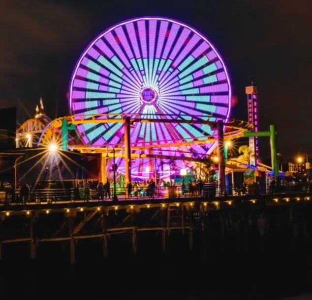The Pacific Wheel was lit in purple and featured an evening light program that displayed the BTS logo on Friday, November 26