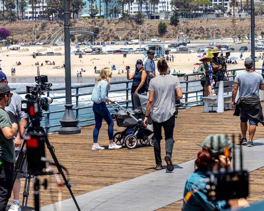 A film crew works on the Santa Monica Pier boardwalk during a taping for Amazon's Sweet Tooth | Photo by @focusbridge_productions
