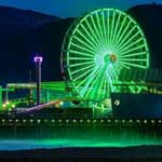 Green lights glow from the Pacific Wheel in Santa Monica on St Patrick's Day 2022
