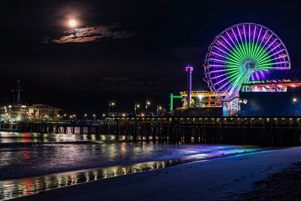 International Women's Day Celebrated at the Santa Monica Pier with a lighting of the Pacific Wheel in Green and Purple.