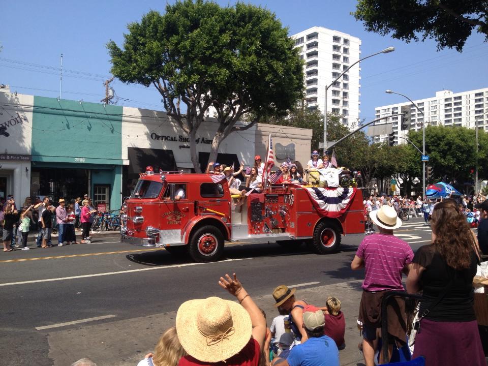 A classic fire truck driving down Main Street in Santa Monica's annual 4th of July Parade
