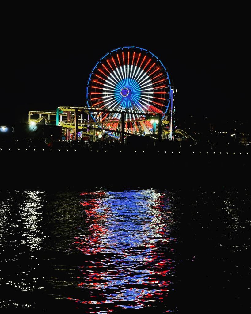 Red, white, and blue lights displayed on the Pacific Wheel in Santa Monica - Photo by @mr_selvin
