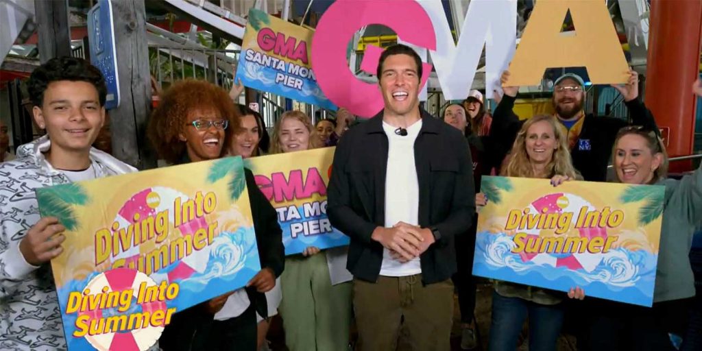 Good Morning America's Will Reeve at the Santa Monica Pier with GMA Super Fans holding signs and cheering