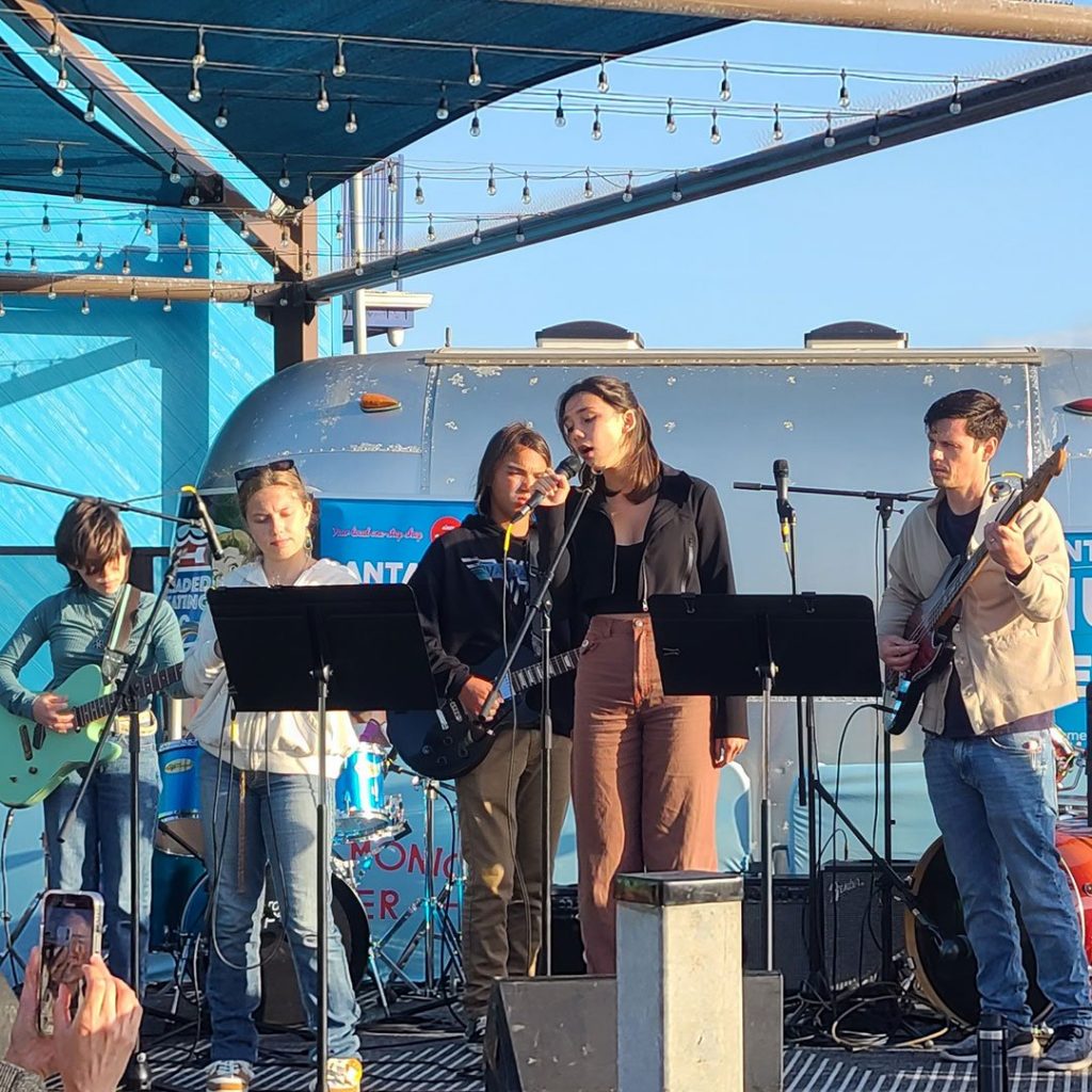 Student musicians perform on stage at the Santa Monica Pier
