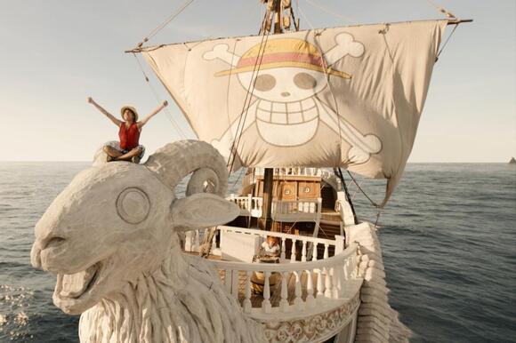 Scene from the upcoming live-action adaptation of One Piece depicting Monkey D. Luffy played by Iñaki Godoy aboard their pirate ship.