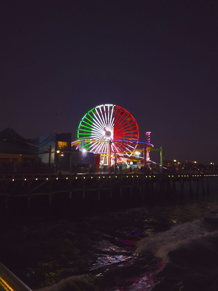 The green, white, and red flag of Mexico displayed in lights on the Pacific Wheel in Santa Monica.