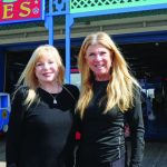 Joanie and Marlene Gordon in front of Playland Arcade at the Santa Monica Pier