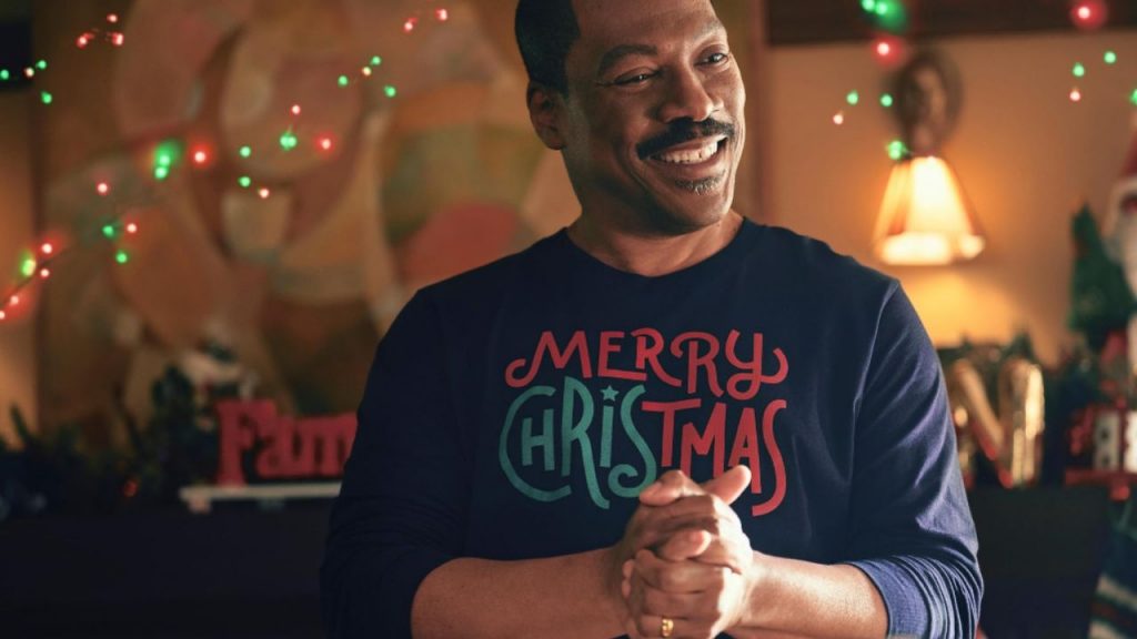 Actor Eddie Murphy in a festive holiday sweater as character Chris Carver in Amazon Prime's Candy Cane Lane