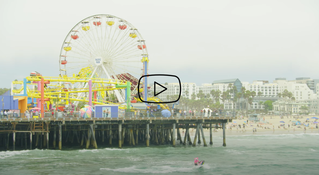 Clown on jet ski in front of Santa Monica Pier Ferris Wheel